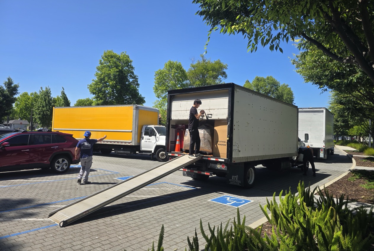 B2 Moving crew loading a truck with a ramp