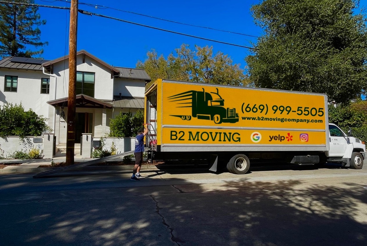 B2 Moving truck driving through a residential street