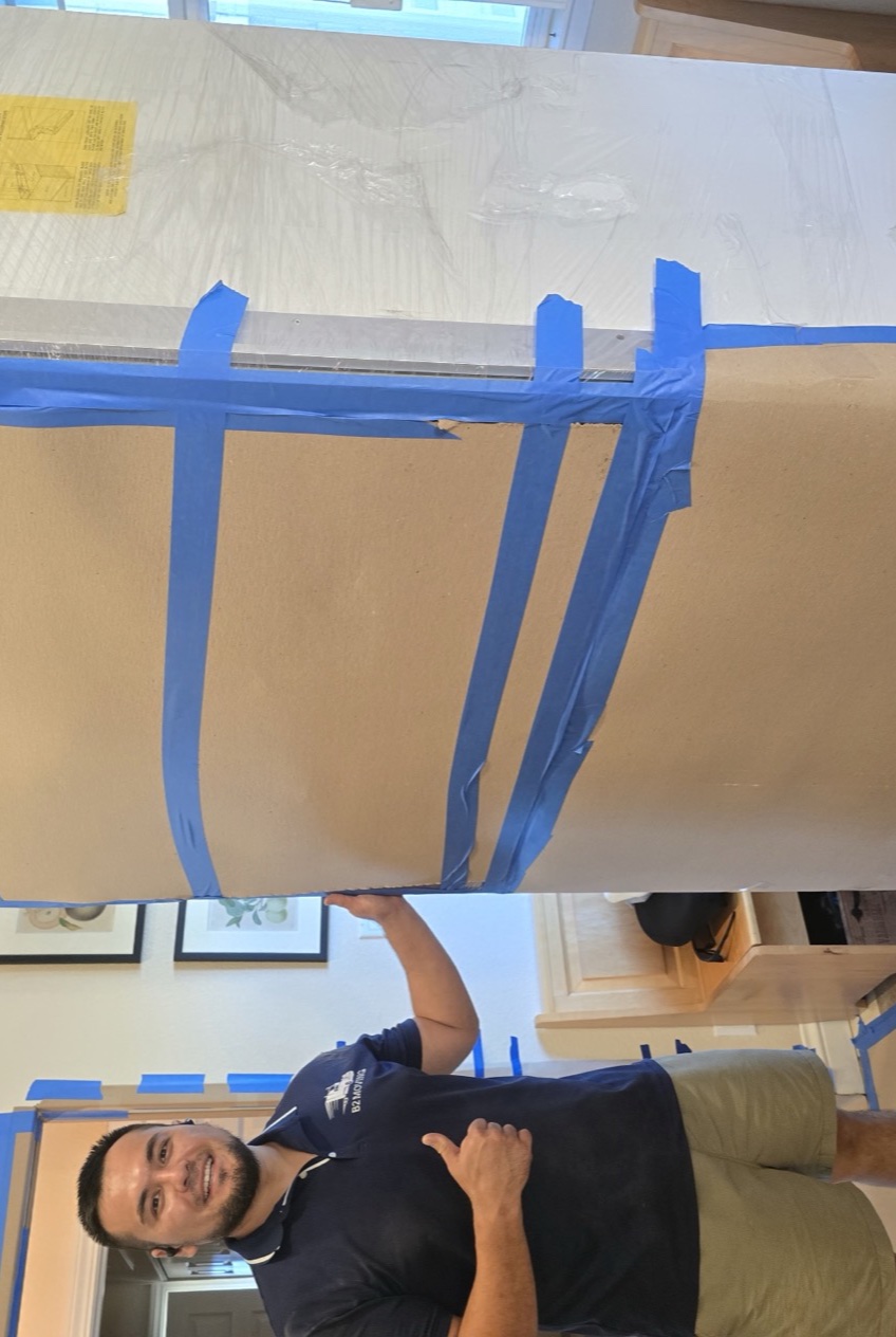Mover with a shrink-wrapped dresser