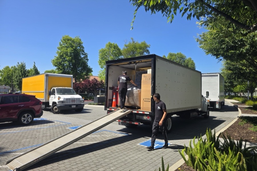 Crew loading the truck by ramp